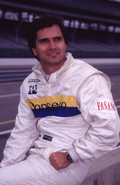 Formula One driver Nelson Piquet sits on pit wall awaiting practice for 1992 Indianapolis 500. -- Photo by: No Photographer