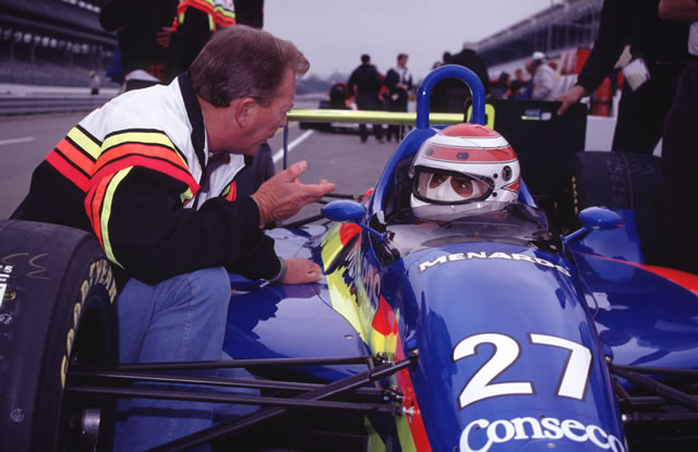 Gary Bettenhausen gives Nelson Piquet some tips as he sits in his #27 Menards Conseco Buick on pit lane. -- Photo by: No Photographer