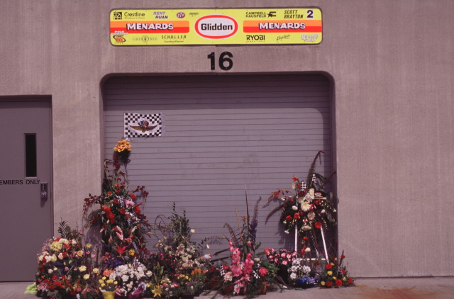 Flowers are left outside of Scott Brayton's garage in remembrance.   -- Photo by: No Photographer