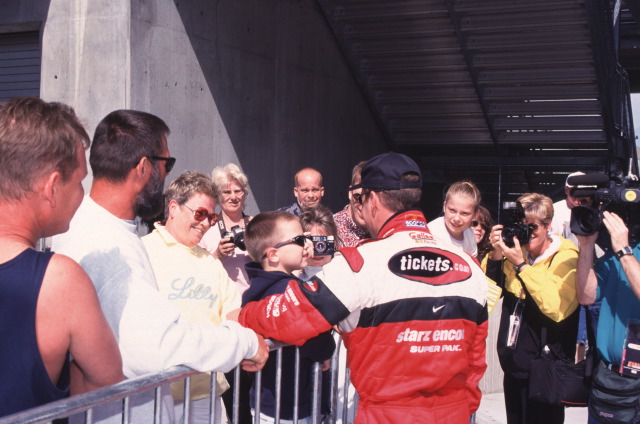Two-time Indianapolis 500 winner Al Unser Jr. talks with some fans. -- Photo by: No Photographer