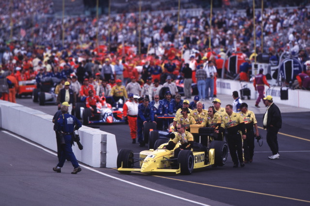 The #4, Pennzoil Panther Dallara, Dallara, Oldsmobile is pushed to the starting grid for the 2000 Indianapolis 500. -- Photo by: No Photographer