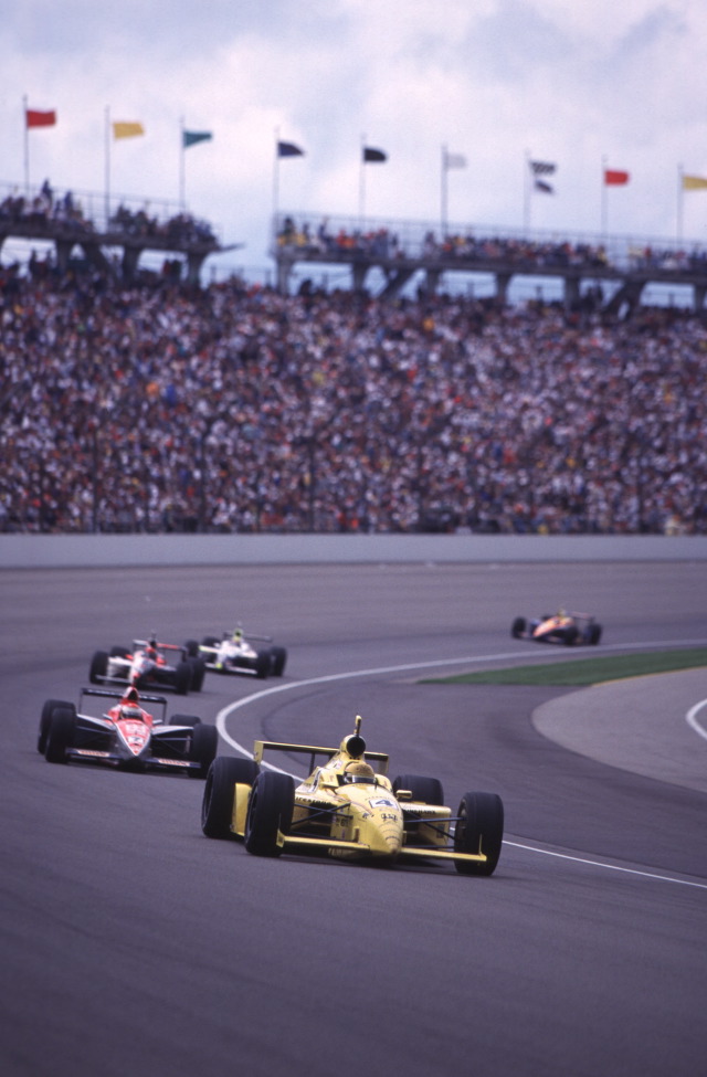 Scott Goodyear, driving the #4, Pennzoil Panther Dallara, Dallara, Oldsmobile leads a group of cars through a turn. -- Photo by: No Photographer