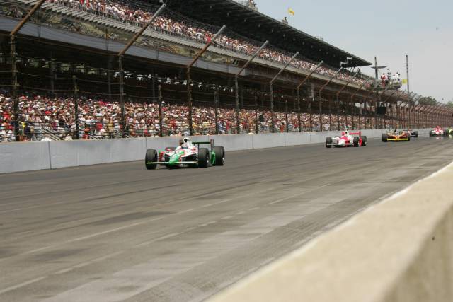 Tony Kanaan in the #11 Team 7-Eleven Dallara/Honda leads the pack during the start of the 89th running of the Indianapolis 500 at the Indianapolis Motor Speedway. -- Photo by: Michael Voorhees