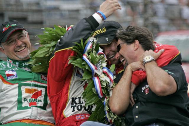 Dan Wheldon celebrates his winning the 89th running of the Indianapolis 500 with team owners Micheal Andretti (far right), Kim Green (left) at the Indianapolis Motor Speedway.  -- Photo by: Michael Voorhees