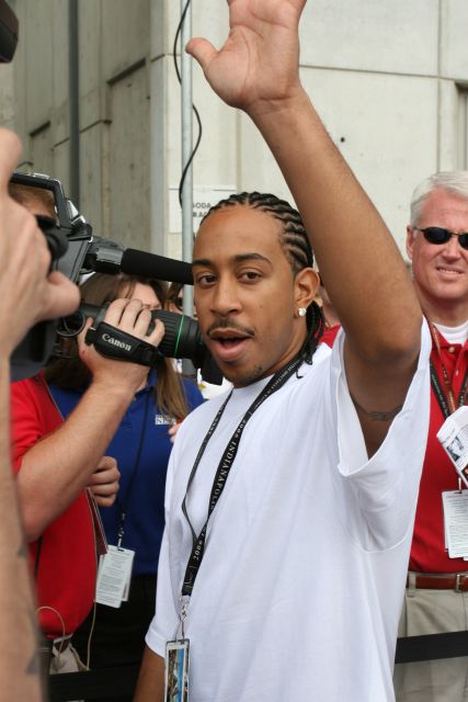 Musical artist Ludacris waves to the crowd during the 90th running of the Indianapolis 500. -- Photo by: Dave Edelstein