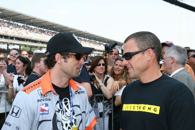 Lance Armstrong, right, talks to actor and co-owner of Vision Racing, Patrick Dempsey. Lance drove the Chevrolet Corvette Z06 pace car in the 90th running of the Indianapolis 500. -- Photo by: Dave Edelstein
