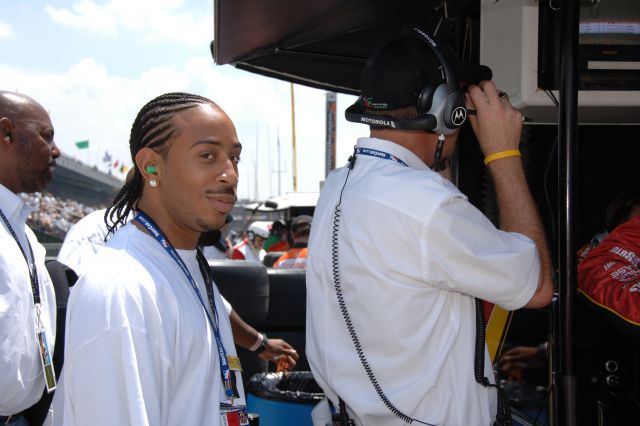 Musical artist Ludacris smiles while hanginb out near the Adretti Green Racing pits at the 90th running of the Indianapolis 500. -- Photo by: Dana Garrett