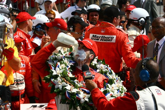 Without breaking tradition, Sam Hornish Jr. pours milk all over his face after winning the 90th running of the Indianapolis 500. -- Photo by: Shawn Payne