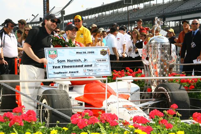 Sam Hornish Jr. accepts the $10,000 Tag Heuer award after winning the 90th running of the Indianapolis 500. -- Photo by: Shawn Payne