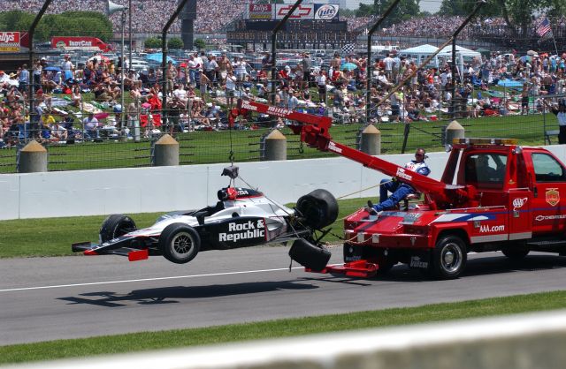Tomas Scheckter's No. 2 Vision Racing car is towed into the pits after he collided with a wall during the 90th running of the Indianapolis 500. -- Photo by: Steve Snoddy