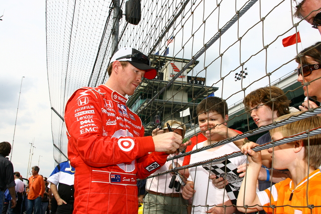 Scott Dixon signs autographs during qualifications on Pole Day at the Indianapolis Motor Speedway. -- Photo by: Jim Haines