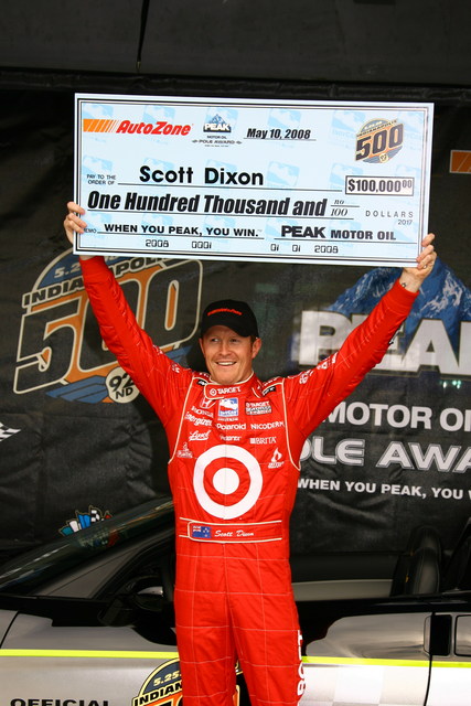 PEAK Motor Oil Pole Award winner Scott Dixon hold his trophy high after qualifications on Pole Day at the Indianapolis Motor Speedway. -- Photo by: Jim Haines