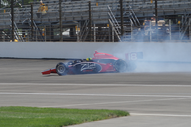Bruno Junqueira spins during qualifications on Pole Day at the Indianapolis Motor Speedway. -- Photo by: Jessica Hoffman