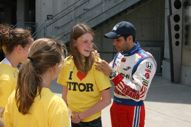 Vitor Meira signs autographs during qualifications on Pole Day at the Indianapolis Motor Speedway. -- Photo by: Steve Snoddy
