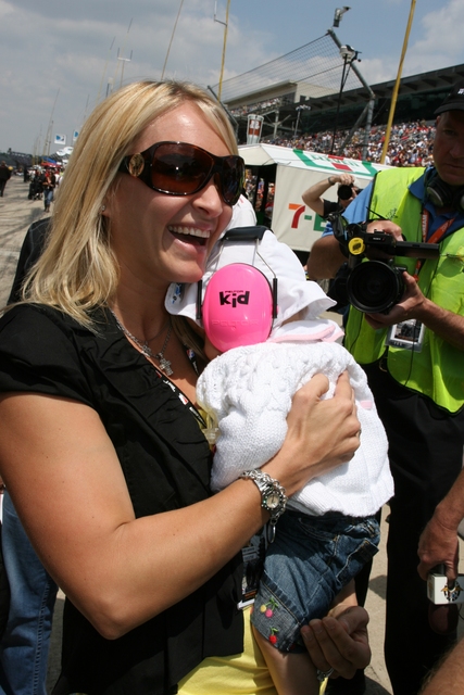 Ed Carpenter's wife, Heather, and baby daughter, Makenna, watch during qualifications on Pole Day at the Indianapolis Motor Speedway. -- Photo by: Steve Snoddy