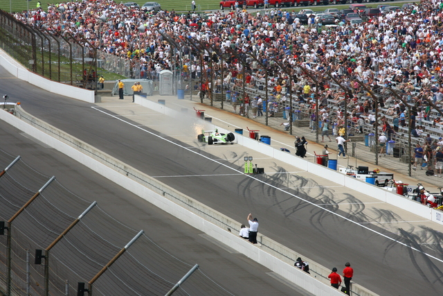 Alex Lloyd makes contact with the pit lane wall after bouncing off the Turn 4 wall during the 92nd Indianapolis 500. -- Photo by: Bret Kelley