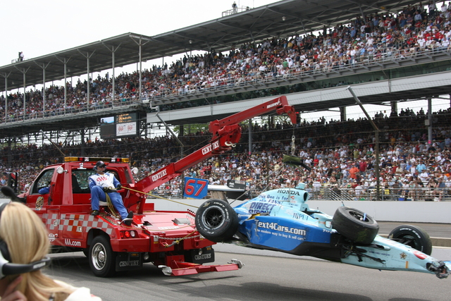 A Safety Truck removes the #67 car driven by Sarah Fisher, after she made contact with Tony Kanaan during the 92nd Indianapolis 500. -- Photo by: Chris Jones