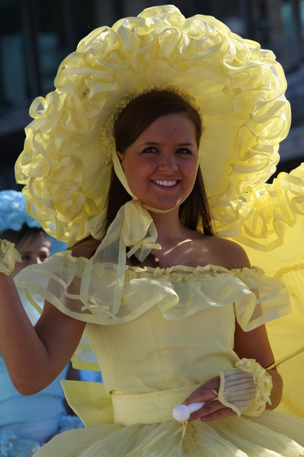 Touch of spring, young lady waves to fans, on Race Day At the Indianapolis Motor Speedway. -- Photo by: Dana Garrett