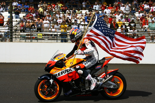 Nicky Haden takes the American flag for a lap around the Indianapolis Motor Speedway during pre-race festivities for the 92nd Indianapolis 500. -- Photo by: Jim Haines