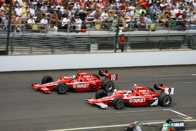 No. 10 Dan Wheldon and No. 9 Scott Dixon run side by side on Race Day at the Indianapolis Motor Speedway. -- Photo by: Jim Haines