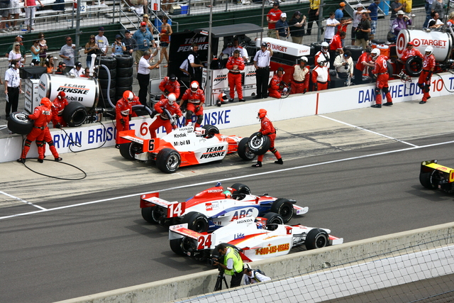 IndyCars try to beat eachother out of the pits during the 92nd Indianapolis 500. -- Photo by: Jim Haines