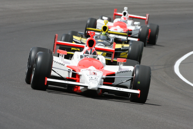Helio Castroneves leads Tomas Scheckter and Ryan Briscoe during the 92nd Indianapolis 500. -- Photo by: Steve Snoddy