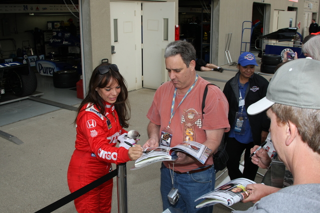 Milka Duno signs autographs in Gasoline Alley -- Photo by: Jim Haines