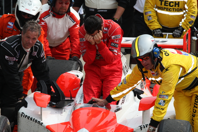 Helio Castroneves is overcome with emotion as the car is moved to Victory Circle. -- Photo by: Dana Garrett