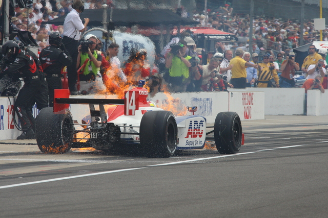 Vitor Meira's car on fire on pit lane. It was quickly extinguished and he continued in the race. -- Photo by: Shawn Payne