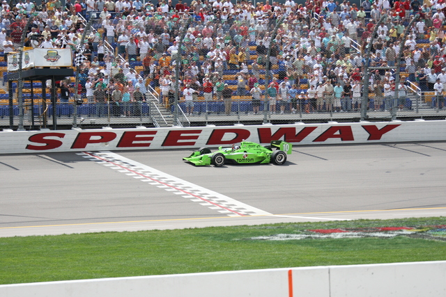 Dario Franchitti takes the checkered flag in the Iowa Corn Indy250 presented by Pioneer. -- Photo by: Ron McQueeney