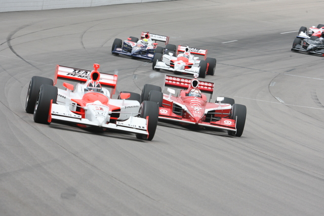 The cars of Helio Castroneves (3) and Scott Dixon race early on. -- Photo by: Steve Snoddy