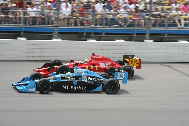 Tomas Scheckter (23) and Graham Rahal race early on. -- Photo by: Steve Snoddy