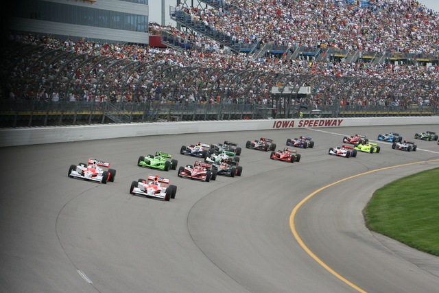 Helio Castroneves, right, and Ryan Briscoe lead the field into Turn 1 on the first lap. -- Photo by: Steve Snoddy