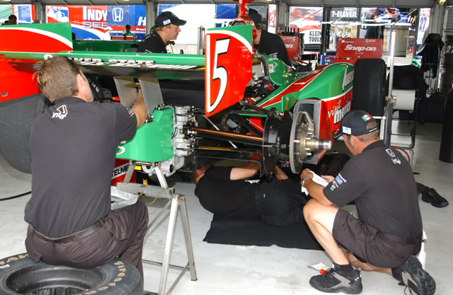 #5 Fernandez Racing crew at work on Adrian's car -- Photo by: Dana Garrett