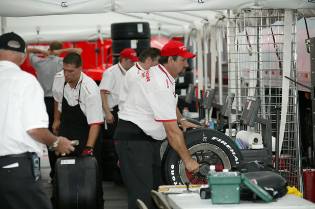 Firestone crew members prepare for track activity at Kansas Speedway -- Photo by: Ron McQueeney
