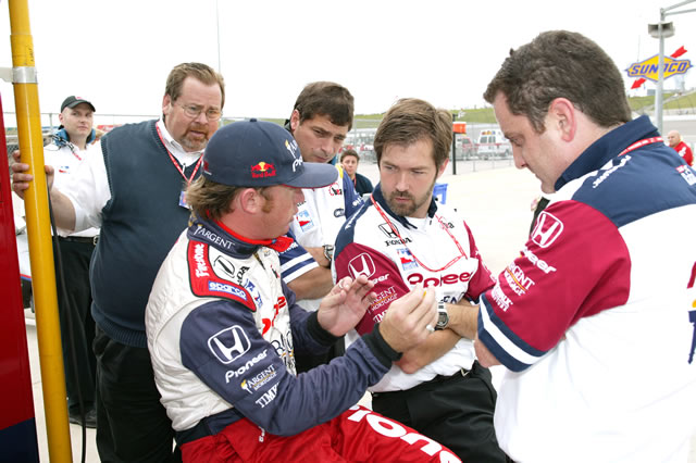 #15 Rahal-Letterman Racing driver, Buddy Rice confers with crew members -- Photo by: Ron McQueeney