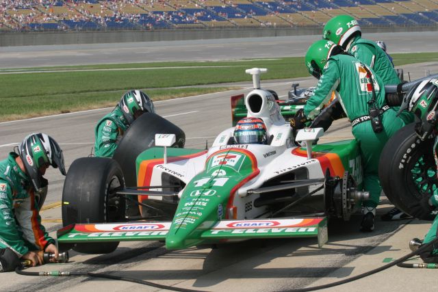 Tony Kanaan and crew work during a pit stop. -- Photo by: Chris Jones