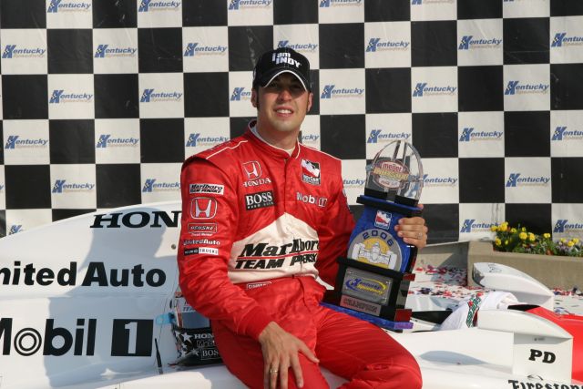 Sam Hornish Jr. poses with the trophy in Victory Circle at Kentucky. -- Photo by: Chris Jones