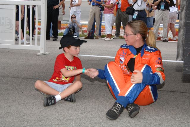 Sarah Fisher chats with a young fan. -- Photo by: Jim Haines