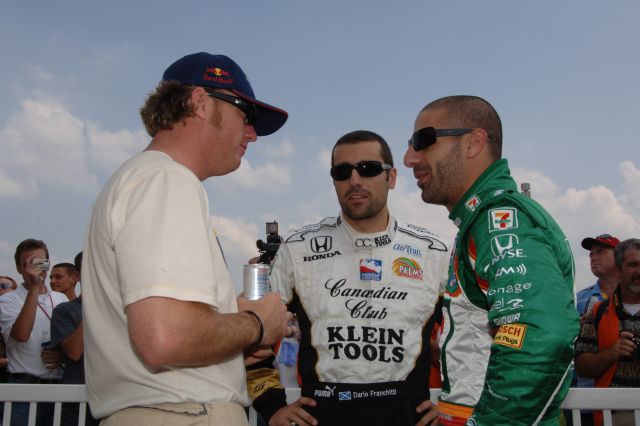 Drivers Buddy Rice, Dario Franchitti and Tony Kanaan talk after driver introductions. -- Photo by: Jim Haines