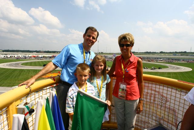 Honorary starter poses with Family in the flag Stand at Kentucky. -- Photo by: Shawn Payne