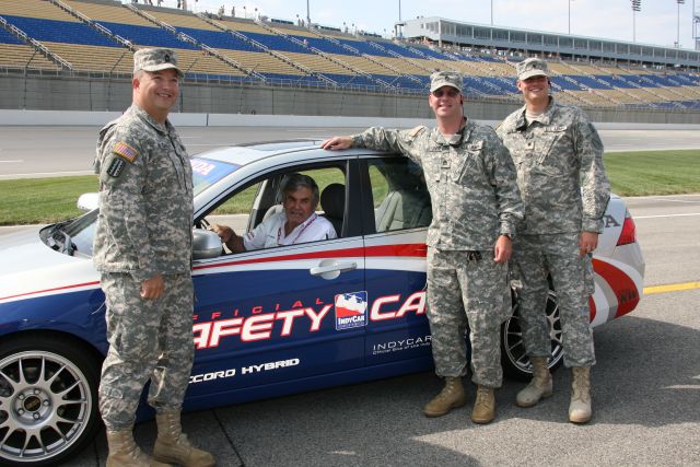 Members of the Armed Forces pose with the Safety Official on Meijer Indy 300 Race day. -- Photo by: Dana Garrett