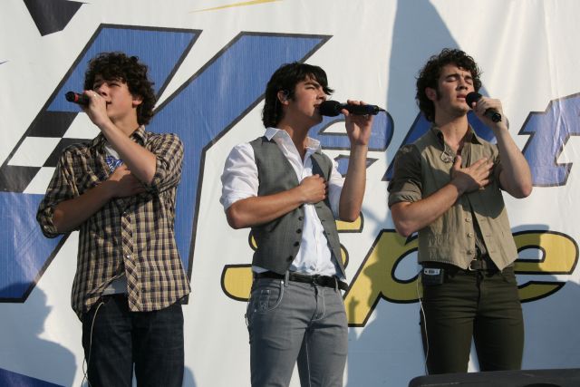 Jonas Brothers preform the National Anthem at the Kentucky Speedway on race day. -- Photo by: Dana Garrett