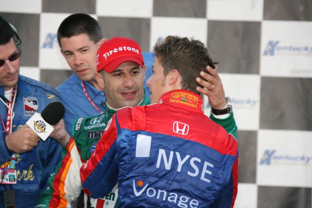 Tony Kanaan gets a hug from Marco Andretti after winning the Meijer Indy 300 at Kentucky Speedway. -- Photo by: Dana Garrett