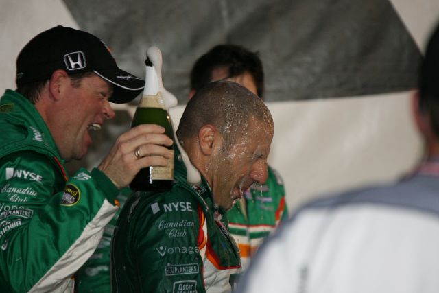 Tony Kanaan gets a shower by his crew after 
winning the Meijer Indy 300 at Kentucky Speedway. -- Photo by: Dana Garrett