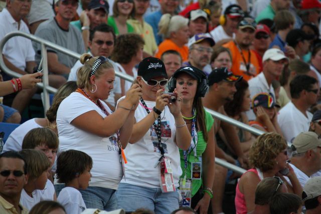 Fans compare their photos on Meijer Indy 300 Race day in Kentucky. -- Photo by: Shawn Payne