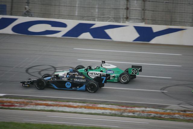 Extremely close racing action between Danica Patrick and Ed Carpenter during the Meijer Indy 300 Race. -- Photo by: Steve Snoddy