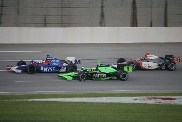 Marco Andretti, Scott Sharp, and A.J. Foyt IV fight for a lead position at Kentucky Speedway. -- Photo by: Steve Snoddy