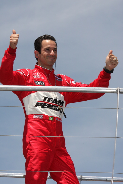 Helio Castroneves acknowledges the applause during driver introductions. -- Photo by: Chris Jones