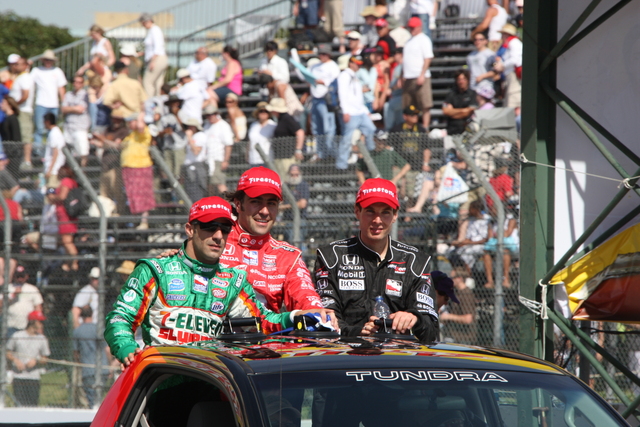 The podium finishers, from left, Tony Kanaan, Dario Franchitti and Will Power take a celebratory lap. -- Photo by: Chris Jones